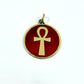 Necklace with a maroon red pendant featuring a gold ankh symbol, handmade of brass