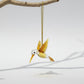 Amber-colored bird-shaped handmade glass ornament