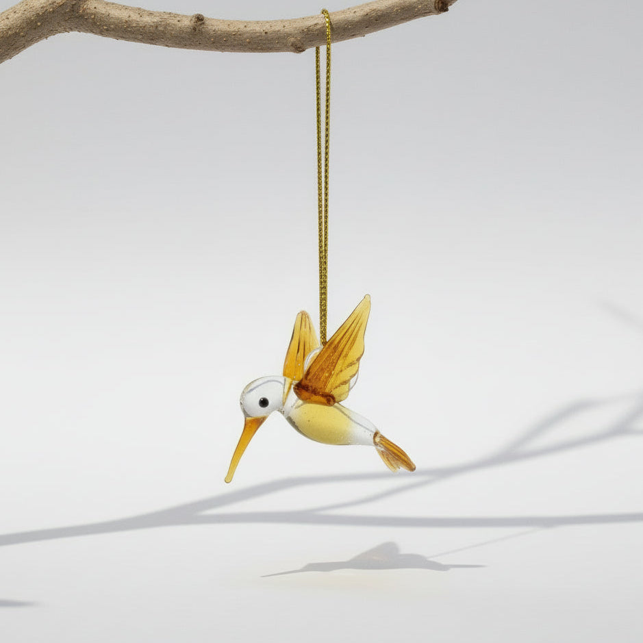 Amber-colored bird-shaped handmade glass ornament