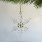 Handmade glass snowflake ornament with gold accents 