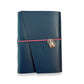 Handbound dark blue leather journal with a diagonal fold closure, secured by an elastic band featuring a silver scarab charm