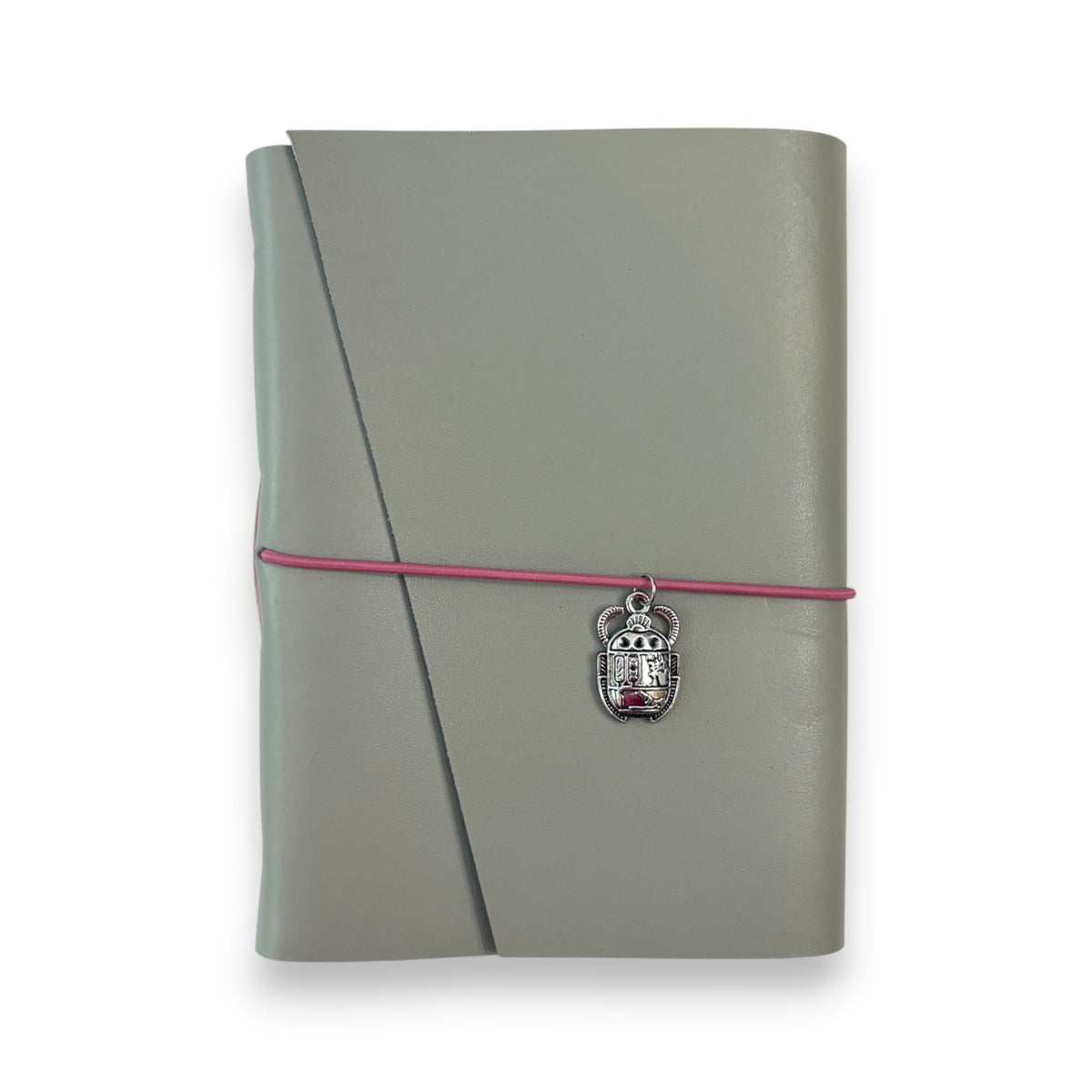 Gray handbound leather notebook with a diagonal fold design, wrapped with a pink elastic cord and featuring a silver-toned scarab charm
