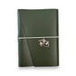 Dark green handbound leather journal with a wrap-around elastic strap and a gold metal Eye of Horus Charm