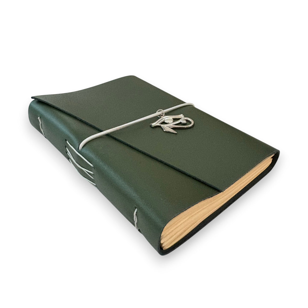 Dark green handbound leather journal with a wrap-around elastic strap and a gold metal Eye of Horus Charm