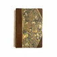 Hand-bound hardcover notebook with brown leather binding and corners, featuring a marbled Ebru paper and thin gold decorative lines, Fair trade handcrafted