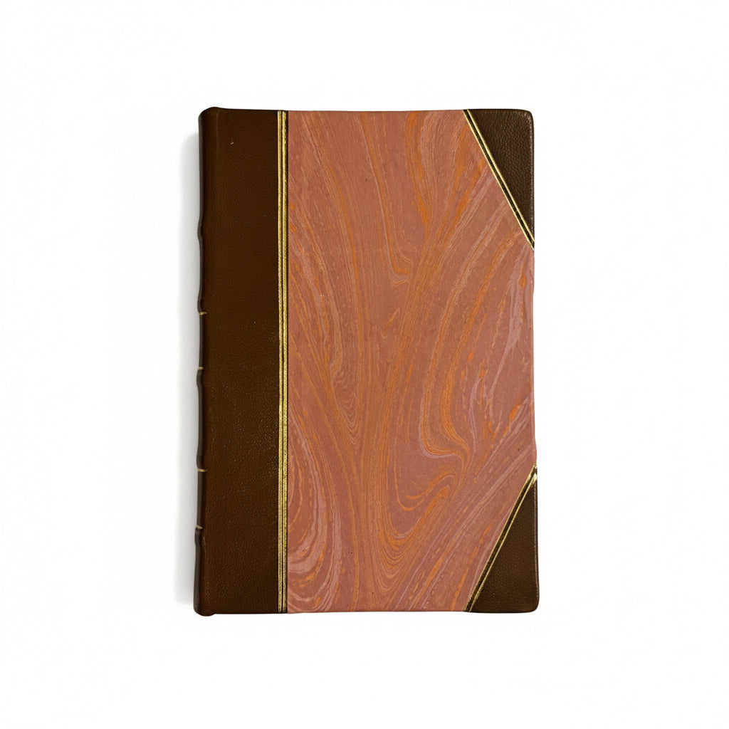 Hand-bound hardcover notebook with brown leather binding and corners, featuring a marbled Ebru paper and thin gold decorative lines, Fair trade handcrafted
