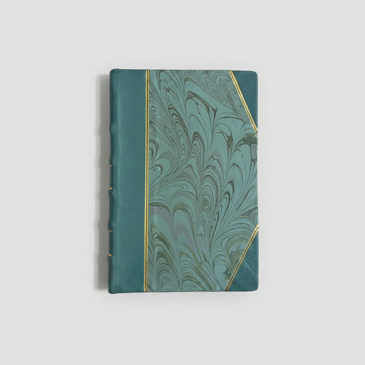 Hand-bound hardcover notebook with teal blue leather binding and corners, featuring a marbled Ebru paper and thin gold decorative lines, Fair trade handcrafted