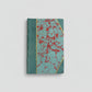 Hand-bound hardcover notebook with teal blue leather binding and corners, featuring a marbled Ebru paper and thin gold decorative lines, Fair trade handcrafted