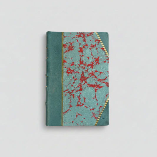 Hand-bound hardcover notebook with teal blue leather binding and corners, featuring a marbled Ebru paper and thin gold decorative lines, Fair trade handcrafted