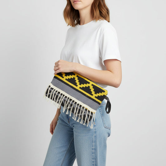 Fair Trade Handwoven kilim clutch bag with geometric pattern and fringes, Ethically Handmade, Sustainable Fashion
