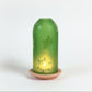 Green upcycled glass lantern with snow flakpatterns ethically handcrafted by women artisans, fair trade