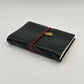 Handcrafted black leather journal with red string and gold Scarab charm, cruelty-free, fair trade, ethically handmade