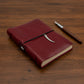 Dandarah handcrafted soft cover red leather notebook with decorative dagger charm, fair trade, ethically handmade