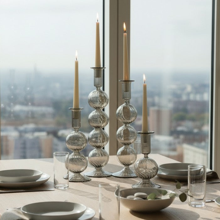 Decorative handblown glass long stem candle holders with baubles in smoky, centerpiece