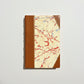 Handbound notebook journal with marbled cover and dark blue leather spine and corners, fair trade