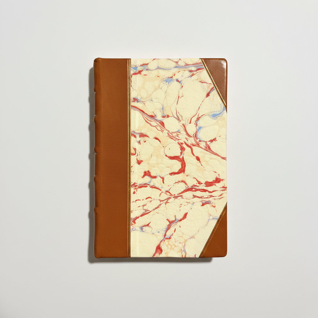 Handbound notebook journal with marbled cover and dark blue leather spine and corners, fair trade