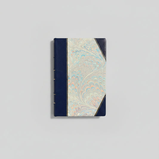 Handbound notebook journal with marbled cover and dark blue leather spine and corners, fair trade