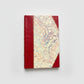 Handmade journal notebook with red leather binding and marbled paper cover, fair trade