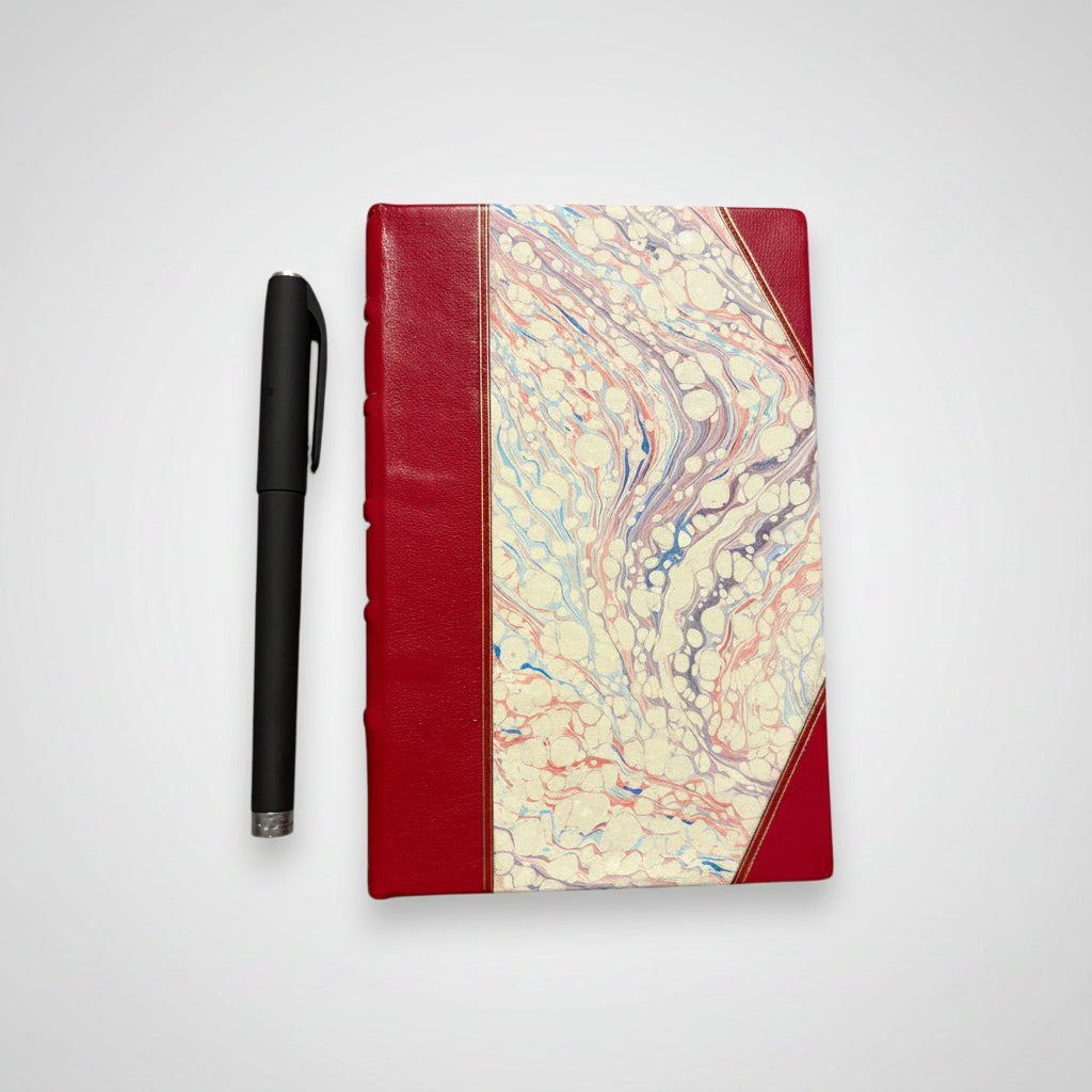 Handmade journal notebook with red leather binding and marbled paper cover, fair trade