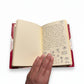 Handmade journal notebook with red leather binding and marbled paper cover, fair trade