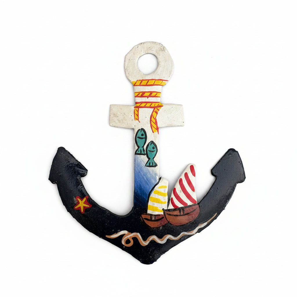 Fair trade handcrafted upcycled metal anchor ornament with a sailboat and fish design, artisan-made, sustainable decor