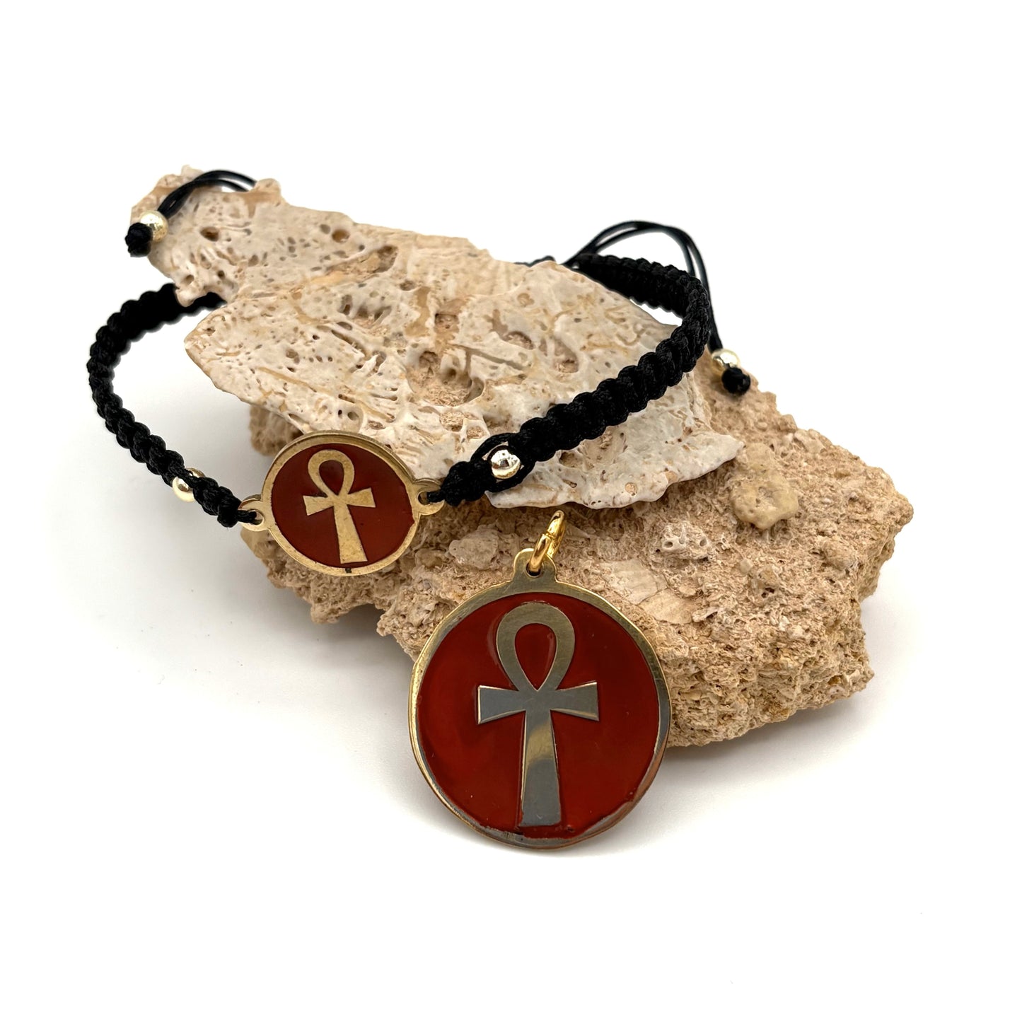Necklace and bracelet with a maroon red medallion featuring a gold ankh symbol, handmade of brass