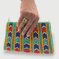 Colorful fair trade hand-beaded clutch with geometric chevron design