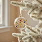 Decorative hand-blown glass bauble ornament with colorful gemstones-like design and gold detail, fair trade handmade