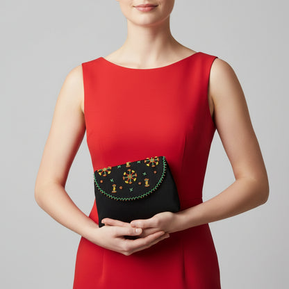 Fair Trade Black clutch with colorful beaded design inspired by embroidery patterns of the Siwa oasis bedouins, sustainable ethically handmade fashion by women artisans