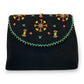 Fair Trade Black clutch with colorful beaded design inspired by embroidery patterns of the Siwa oasis bedouins, sustainable ethically handmade fashion by women artisans