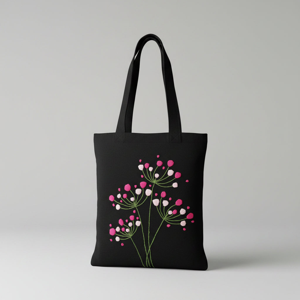 Handmade black tote bag with hand-embroidered fuchsia and pink hydrangea, fair trade