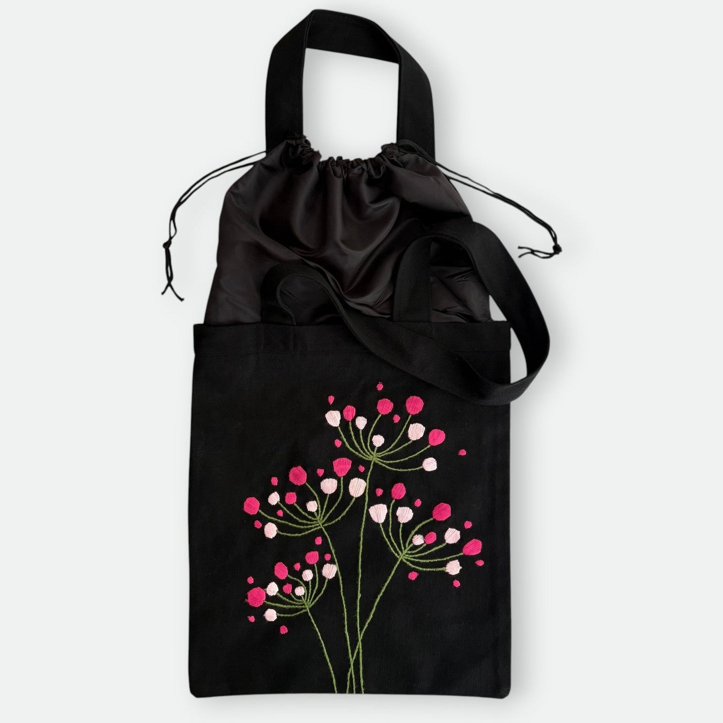 Handmade black tote bag with hand-embroidered fuchsia and pink hydrangea, fair trade