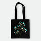 Handmade black tote bag with hand-embroidered white and turquoise hydrangea, fair trade