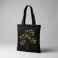 Handmade black tote bag with hand-embroidered yellow and orange hydrangea, fair trade