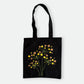 Handmade black tote bag with hand-embroidered yellow and orange hydrangea, fair trade