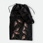 Black canvas tote bag with hand-embroidered pink papyrus design with drawstring lining, fair trade handmade