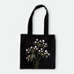 Handmade black tote bag with hand-embroidered white hydrangea, fair trade