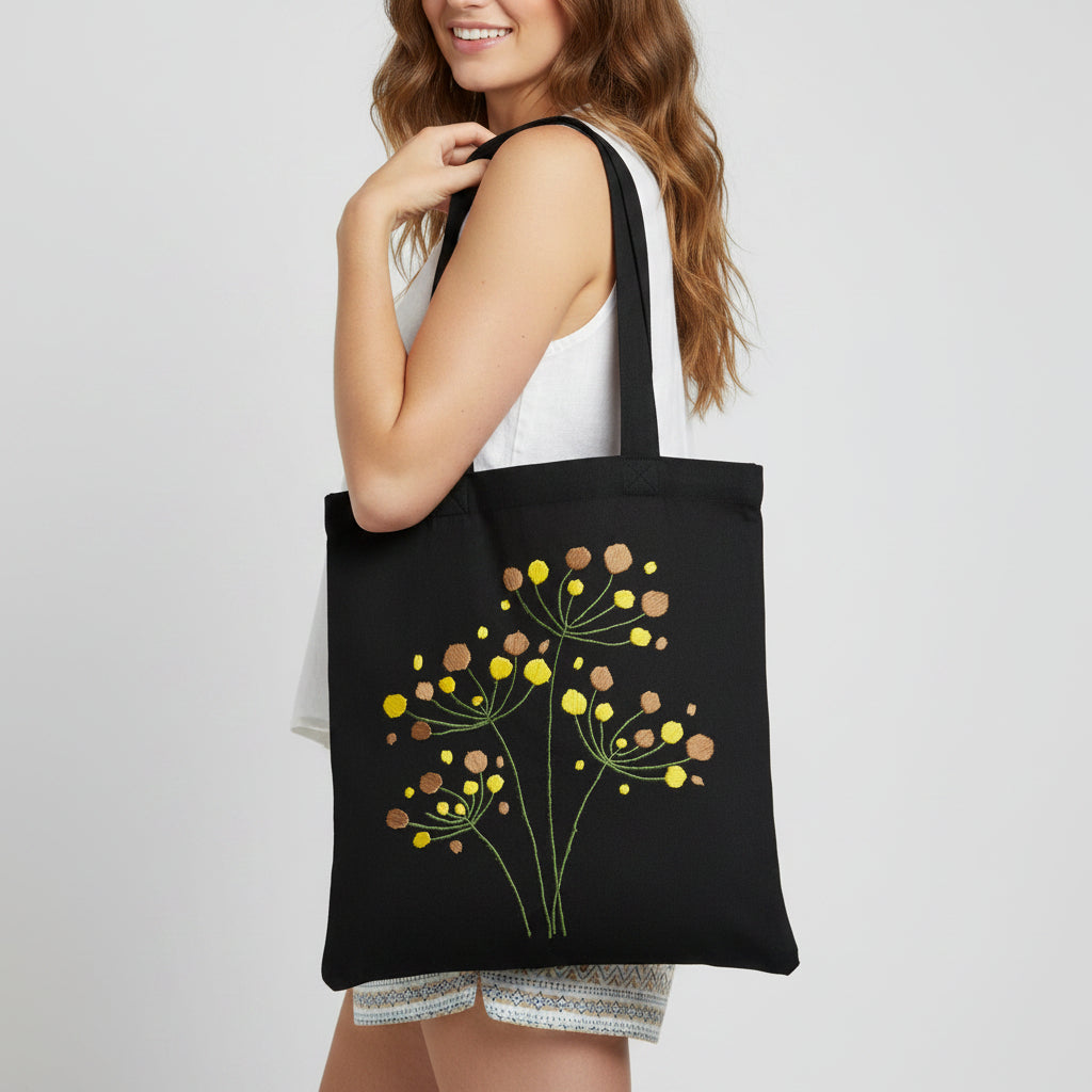 Handmade black tote bag with hand-embroidered yellow and orange hydrangea, fair trade