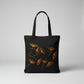 Black canvas tote bag with hand-embroidered orange papyrus design, fair trade handmade