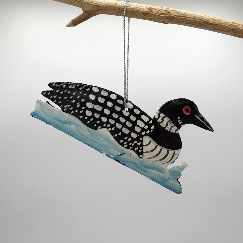Fair trade handcrafted upcycled metal ornament of a swimming loon bird, ethically handmade