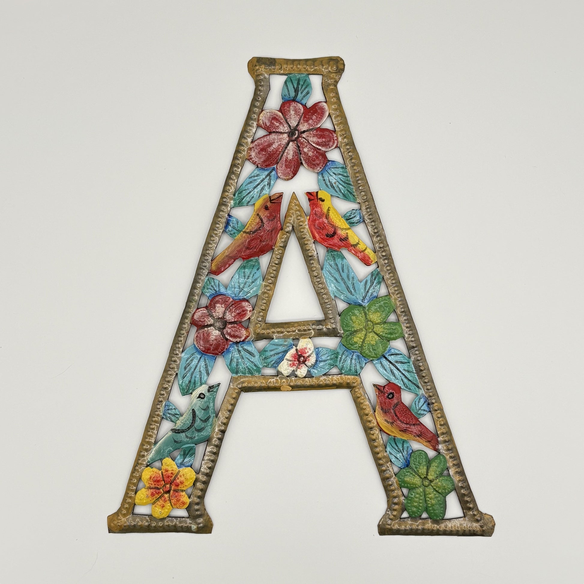 Decorative wall art letter 'A' with floral and bird designs, ethically and sustainably handcrafted, fair trade handmade