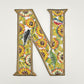 Decorative wall art letter 'N' with floral and bird designs, ethically and sustainably handcrafted, fair trade handmade