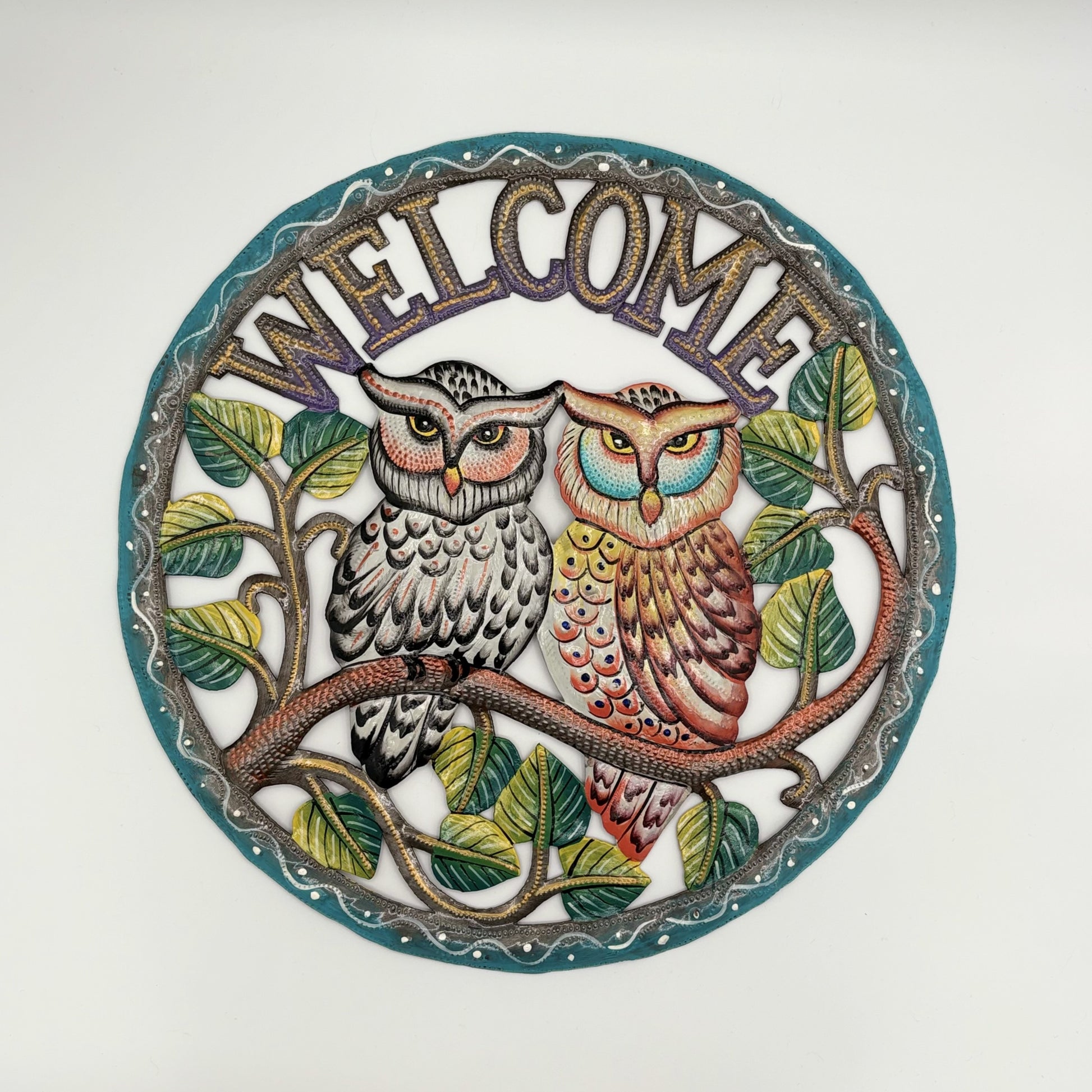 Fair trade eco-friendly handcrafted upcycled metal wall art welcome sign with a couple of owls on a branch, ethically and sustainably handmade