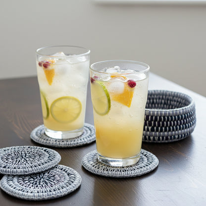 Set of colorful hand-crocheted  coasters in a basket, ethically handcrafted of upcycled textiles, fair trade handmade sustainable