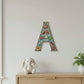 Decorative wall art letter 'A' with floral and bird designs, ethically and sustainably handcrafted, fair trade handmade