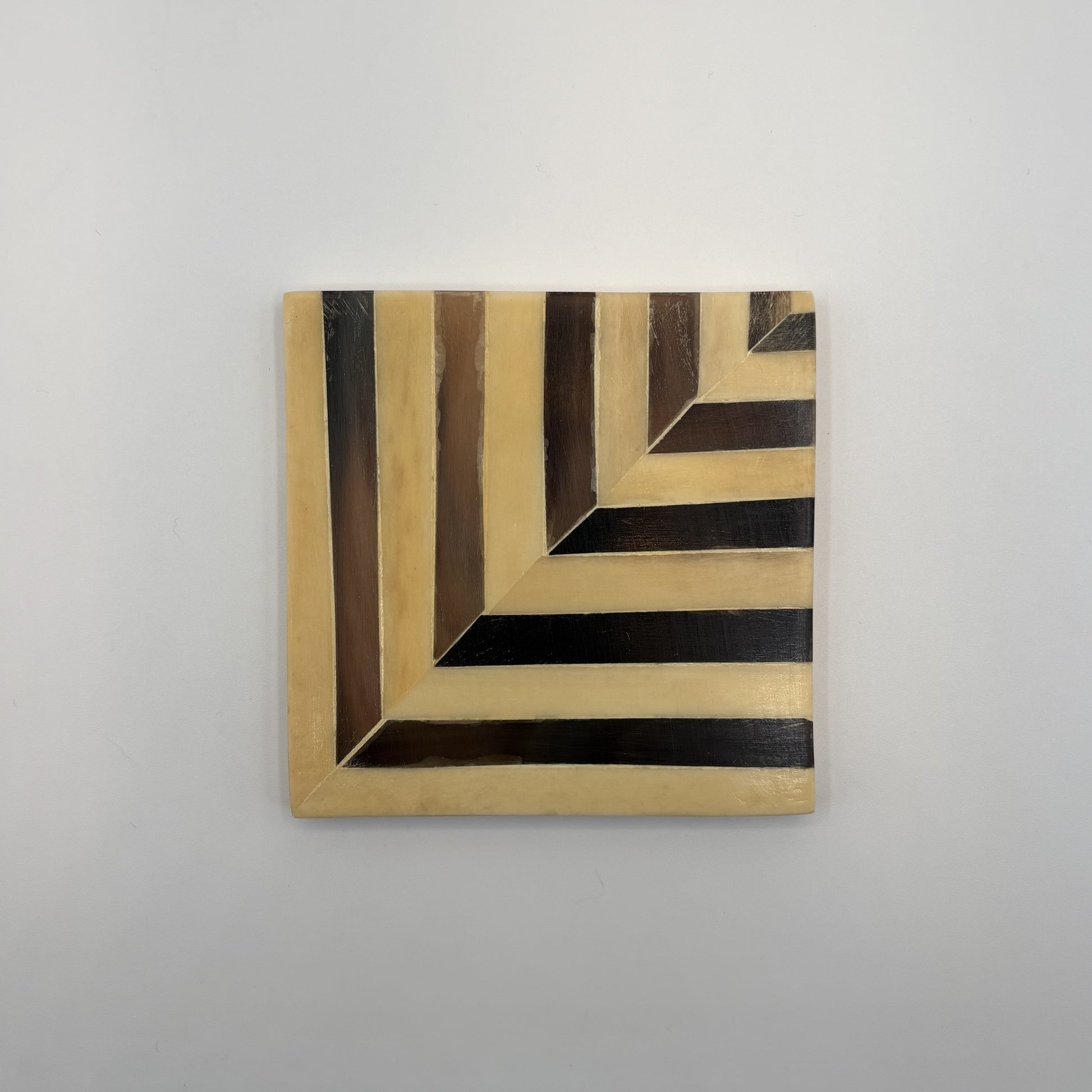 Set of 4 wooden coasters inlaid with camel bone with dark brown and beige chevron pattern, fair trade
