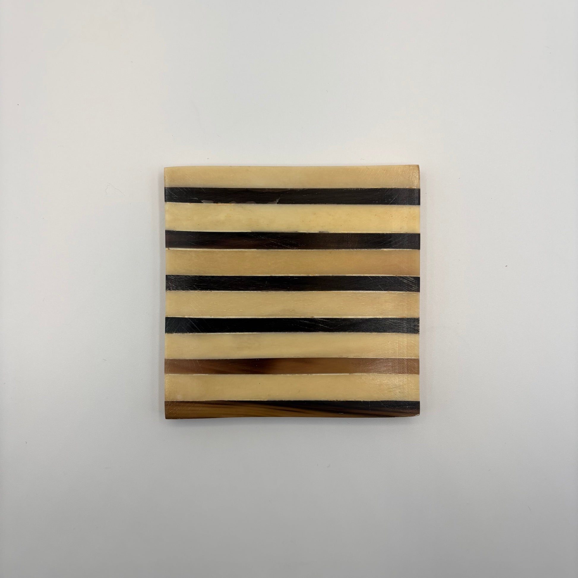 Set of 4 wooden coasters inlaid with camel bone with dark brown and beige stripe pattern, fair trade