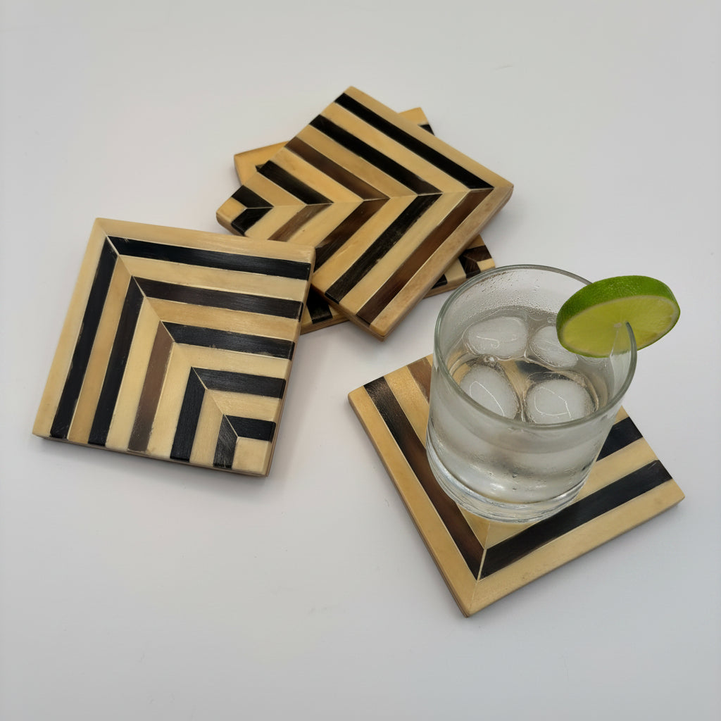 Set of 4 wooden coasters inlaid with camel bone with dark brown and beige chevron pattern, fair trade