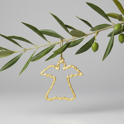 Decorative eco-conscious upcycled metal angel peaceful ornament hanging on an olive branch